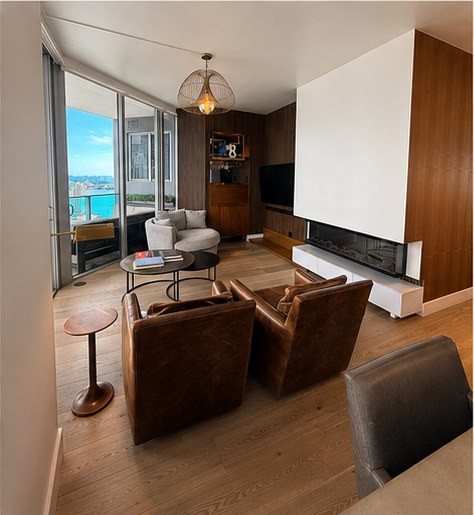 Brickell Miami — living room with fireplace and ocean view